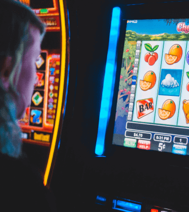 Person playing a slot machine